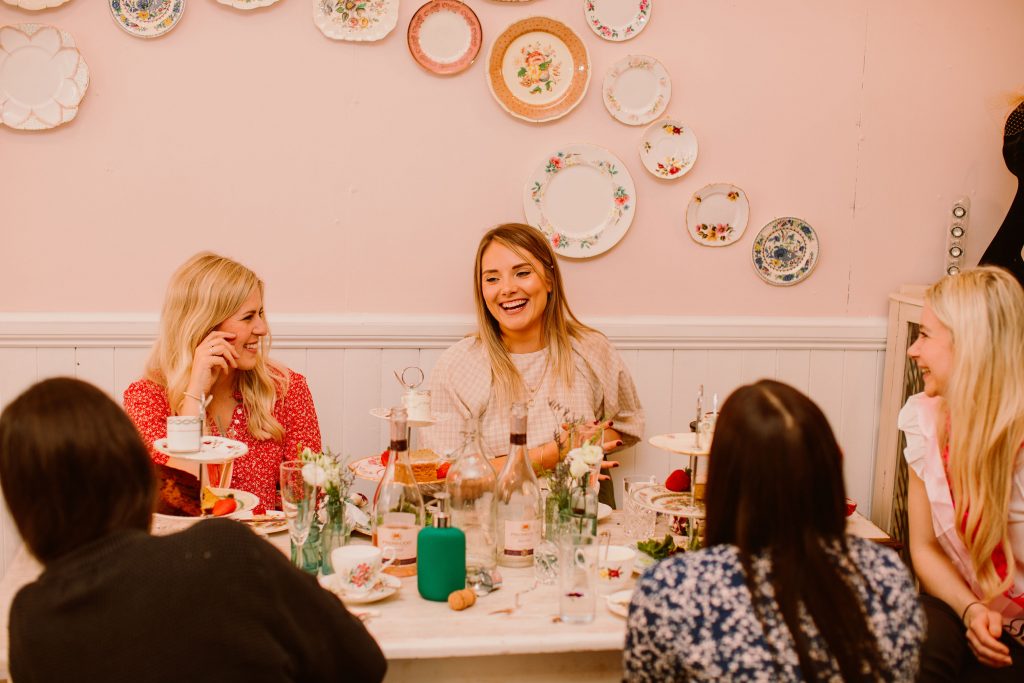 Ladies laughing enjoying afternoon tea at the Ashwell & Co tearoom in Bristol